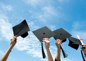 Four Student Hold Cap And Scholarship Wallpaper1